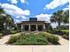 Community clubhouse with landscaping and seating areas at 2905 Black Birch Dr, Ocoee, FL 34761