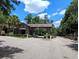 Gated community entrance with stonework and landscaping at 2905 Black Birch Dr, Ocoee, FL 34761