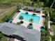 Community pool with lounge chairs and surrounding landscaping at 2905 Black Birch Dr, Ocoee, FL 34761