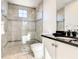 Bathroom with shower, toilet and modern vanity at 550 Muirfield Loop, Reunion, FL 34747