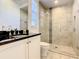 Small bathroom with a walk-in shower and white vanity at 550 Muirfield Loop, Reunion, FL 34747
