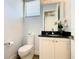 Small bathroom with toilet and vanity at 550 Muirfield Loop, Reunion, FL 34747