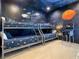 Space-themed bedroom with a triple bunk bed and arcade game at 550 Muirfield Loop, Reunion, FL 34747