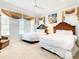 Bedroom with two double beds and window treatments at 550 Muirfield Loop, Reunion, FL 34747