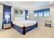 Bedroom with king-size bed and blue accents at 550 Muirfield Loop, Reunion, FL 34747