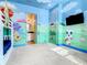 bedroom with bunk beds and playful murals at 550 Muirfield Loop, Reunion, FL 34747