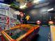 Game room with air hockey, foosball, and arcade games at 550 Muirfield Loop, Reunion, FL 34747