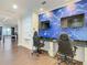 Fun game room with two gaming stations and a large screen at 550 Muirfield Loop, Reunion, FL 34747