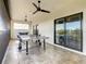 Covered balcony with ping pong table and seating area at 550 Muirfield Loop, Reunion, FL 34747