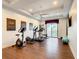 Well-equipped home gym featuring various exercise machines at 550 Muirfield Loop, Reunion, FL 34747