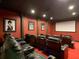 Luxurious home theater with plush seating and large projection screen at 550 Muirfield Loop, Reunion, FL 34747