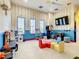 Playroom with furniture and a chalkboard at 550 Muirfield Loop, Reunion, FL 34747