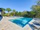 Resort-style pool and spa with plenty of lounge chairs at 550 Muirfield Loop, Reunion, FL 34747