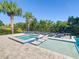 Relaxing pool and spa area with a spacious patio at 550 Muirfield Loop, Reunion, FL 34747