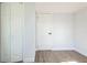 Bright bedroom with white doors and closet, and wood-look flooring at 18925 3Rd Ave, Orlando, FL 32820