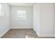 Small bedroom with a single window and wood-look flooring at 18925 3Rd Ave, Orlando, FL 32820
