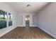 Spacious living room with built-in shelving and wood-look flooring at 18925 3Rd Ave, Orlando, FL 32820