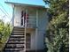 Two-story building with a wooden staircase and porch at 1824 Salem Rd, Lakeland, FL 33803