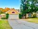 Attractive yellow house with a two-car garage at 1921 Nicholas Pl, Saint Cloud, FL 34771