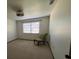 Spacious bedroom with carpeted floor and a chair at 2867 Shadow Wood Ct, Kissimmee, FL 34746