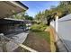 Backyard with pool, fence, and lush landscaping at 4422 Meadowood St, Orlando, FL 32812