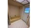 Clean bathroom with shower/tub combo and door to outside at 4422 Meadowood St, Orlando, FL 32812