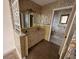 Bright bathroom with double vanity and shower at 4422 Meadowood St, Orlando, FL 32812