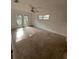 Spacious bedroom with large windows and ceiling fan at 4422 Meadowood St, Orlando, FL 32812