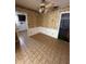 Bright dining room with floral wallpaper and tiled floors at 4422 Meadowood St, Orlando, FL 32812