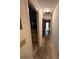 Long hallway with bathroom and door to garage at 4422 Meadowood St, Orlando, FL 32812