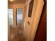 Long hallway with doors to bedrooms and closets at 4422 Meadowood St, Orlando, FL 32812