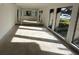 Spacious living room with large windows and hardwood floors at 4422 Meadowood St, Orlando, FL 32812