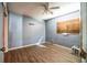 Bedroom with laminate wood flooring, ceiling fan, and neutral colored walls at 4212 Harry Dr, Fruitland Park, FL 34731