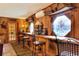 Unique bar area with stained glass windows and wooden finishes at 24120 Mink Rd, Astor, FL 32102