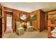 Bedroom with two chairs and access to the bathroom at 24120 Mink Rd, Astor, FL 32102