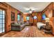 Cozy bedroom with a sofa, a bed, and wood paneled walls at 24120 Mink Rd, Astor, FL 32102