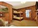 Small bedroom with bunk beds and wood-paneled walls at 24120 Mink Rd, Astor, FL 32102