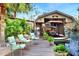 Covered boat dock with a charming vintage boat and seating at 24120 Mink Rd, Astor, FL 32102