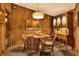 Bright dining area featuring a round glass table and wicker chairs at 24120 Mink Rd, Astor, FL 32102