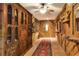 Rustic entry hall with wood walls, tile floors, and antique wooden cabinets at 24120 Mink Rd, Astor, FL 32102