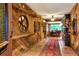 Rustic hallway with wood walls, tiled floor, and unique decor at 24120 Mink Rd, Astor, FL 32102