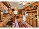 Rustic kitchen with wooden cabinets and a breakfast bar at 24120 Mink Rd, Astor, FL 32102
