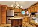 Rustic kitchen with stainless steel appliances and a butcher block island at 24120 Mink Rd, Astor, FL 32102