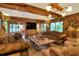 Spacious living room with wooden beams and comfortable seating at 24120 Mink Rd, Astor, FL 32102