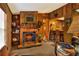 Spacious living room with a fireplace and built-in shelving at 24120 Mink Rd, Astor, FL 32102