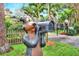 Fun whimsical bear statue holding a mailbox at 24120 Mink Rd, Astor, FL 32102