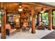Relaxing screened porch with wicker furniture and stone flooring at 24120 Mink Rd, Astor, FL 32102