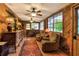 Relaxing sitting room featuring a piano and comfortable armchairs at 24120 Mink Rd, Astor, FL 32102