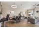 Dining area with a modern table, chairs, and a view into the living room at 527 Miramar Ave, Davenport, FL 33897