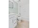 Clean bathroom with white vanity and bathtub at 3800 Saxon Dr # C-52, New Smyrna Beach, FL 32169